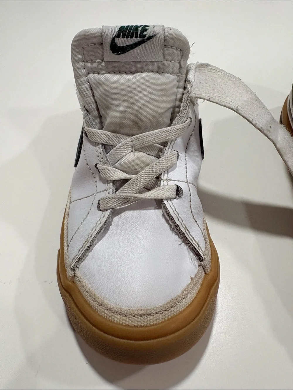 Nike Kids White Sneakers with Green Swoosh and Gum Sole